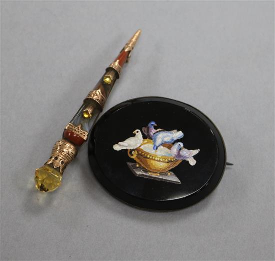 A micromosaic oval Pliny Doves brooch and a yellow metal and Scottish hardstone dirk brooch.